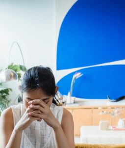 Girl bowing head while telling her story to her counselor Benefit From Counseling