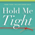 Hold Me Tight 7 conversations for a lifetime of love book cover in teal with a red yarn and a brown yarn tied in a knot under the letter h in tight