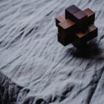 ART and Anxiety making the puzzle work image of a puzzle on a grey wrinkled surface what looks like water flowing over a cliff