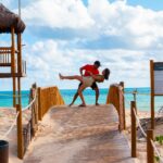 Couples Counseling with a romantic dip embrace at the beach adventure